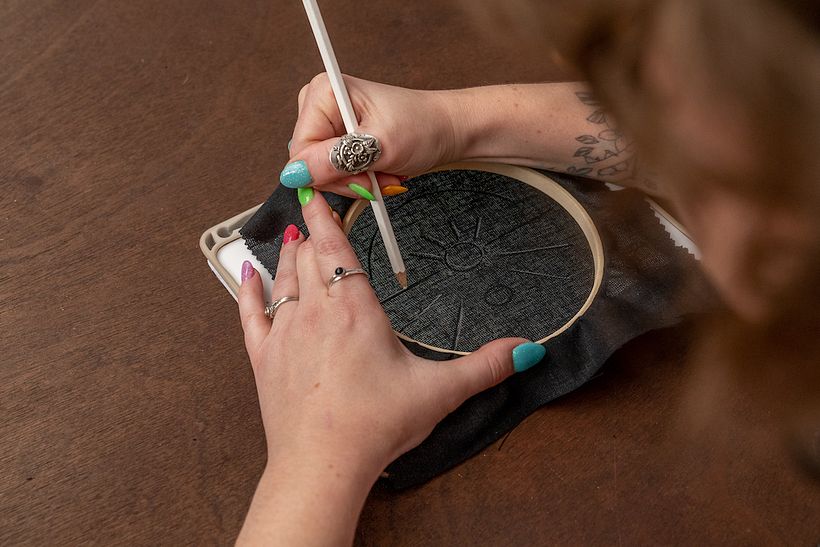 The lightbox method for embroidery pattern transfer.