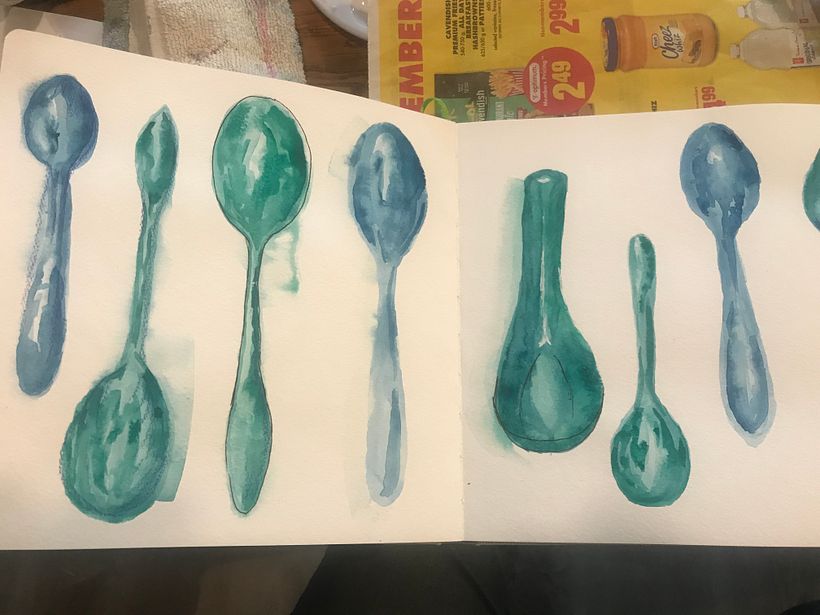 A collection of spoons using different techniques wet on wet, wet on dry,