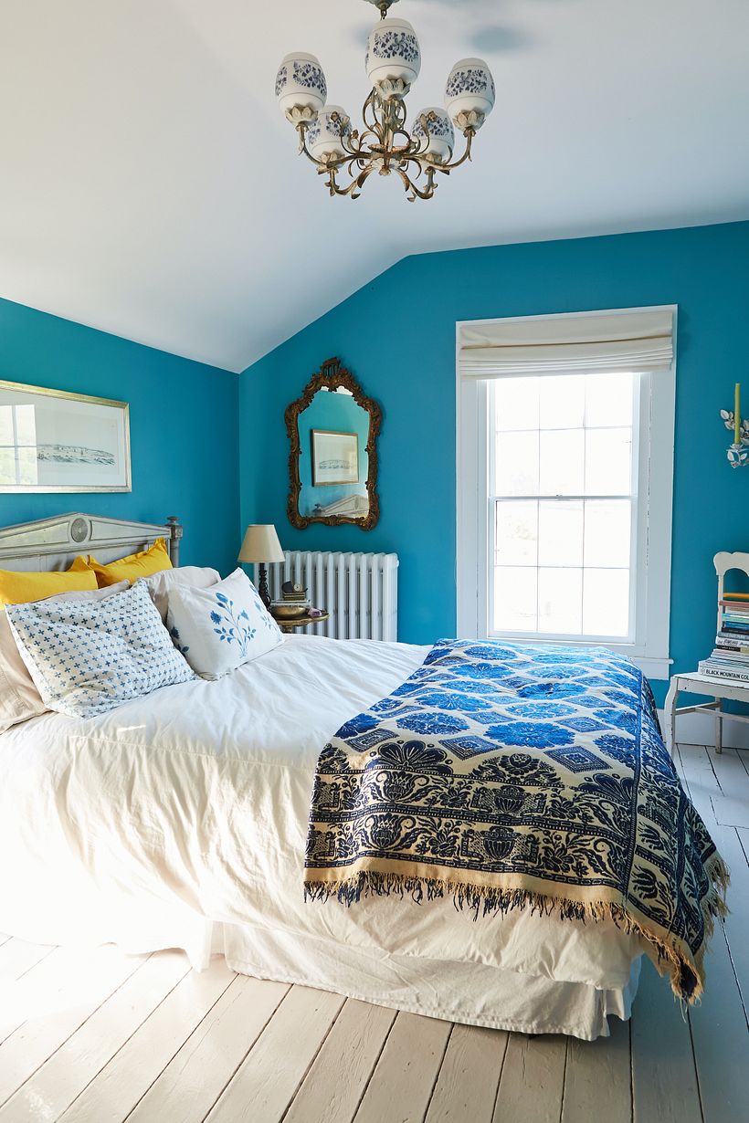 A bright aqua was chosen for this small bedroom.