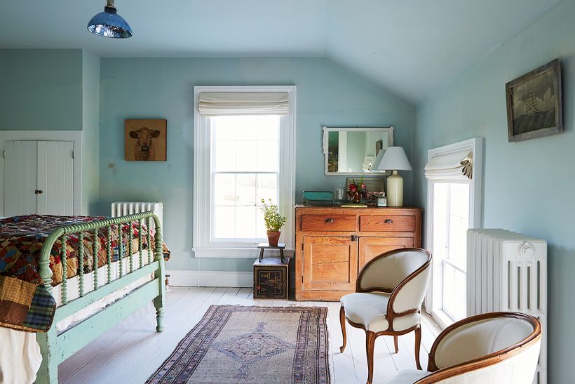 An eclectic array of family furniture in the large bedroom.