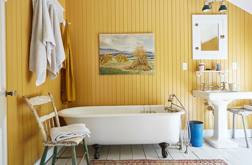 The ochre wall color was taken from the faux Van Gogh haystack painting.