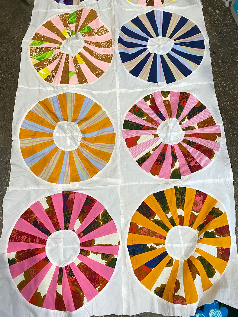 An example of a quilt we found at a flea market that we used to create the sleeves of the top.