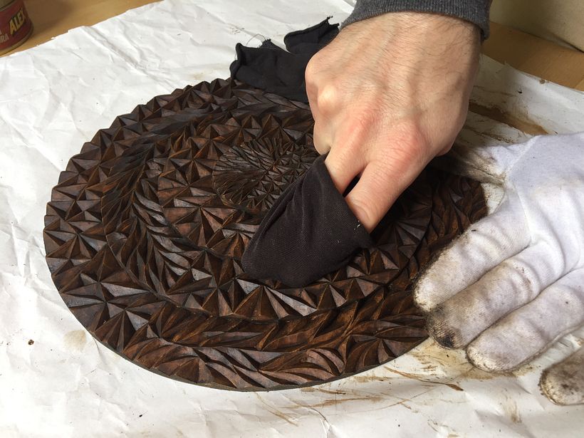 Removing any excess of the stain finishing product.