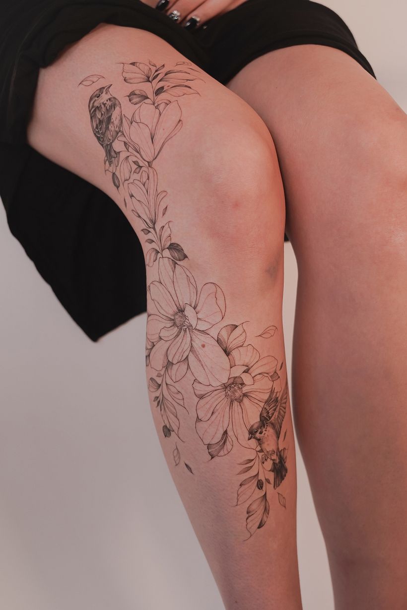 Female Thigh Tattoos with Floral Details
