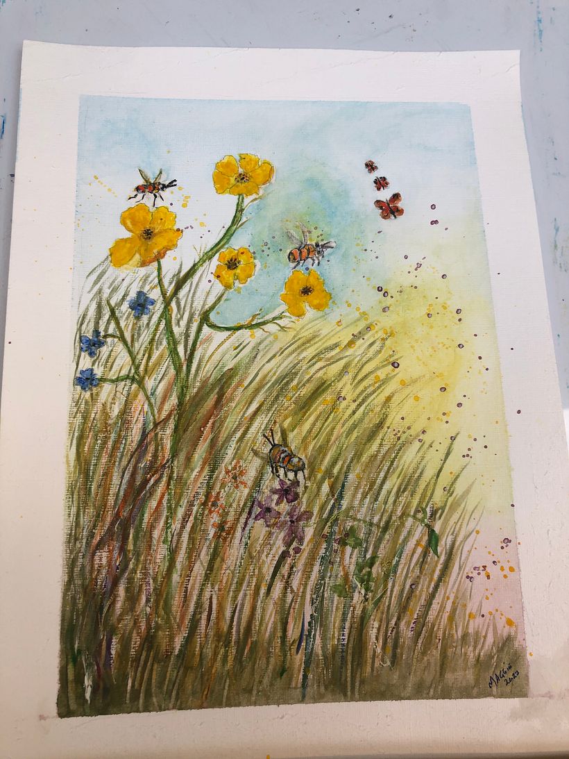 Flowers in a garden with bees and butterflies