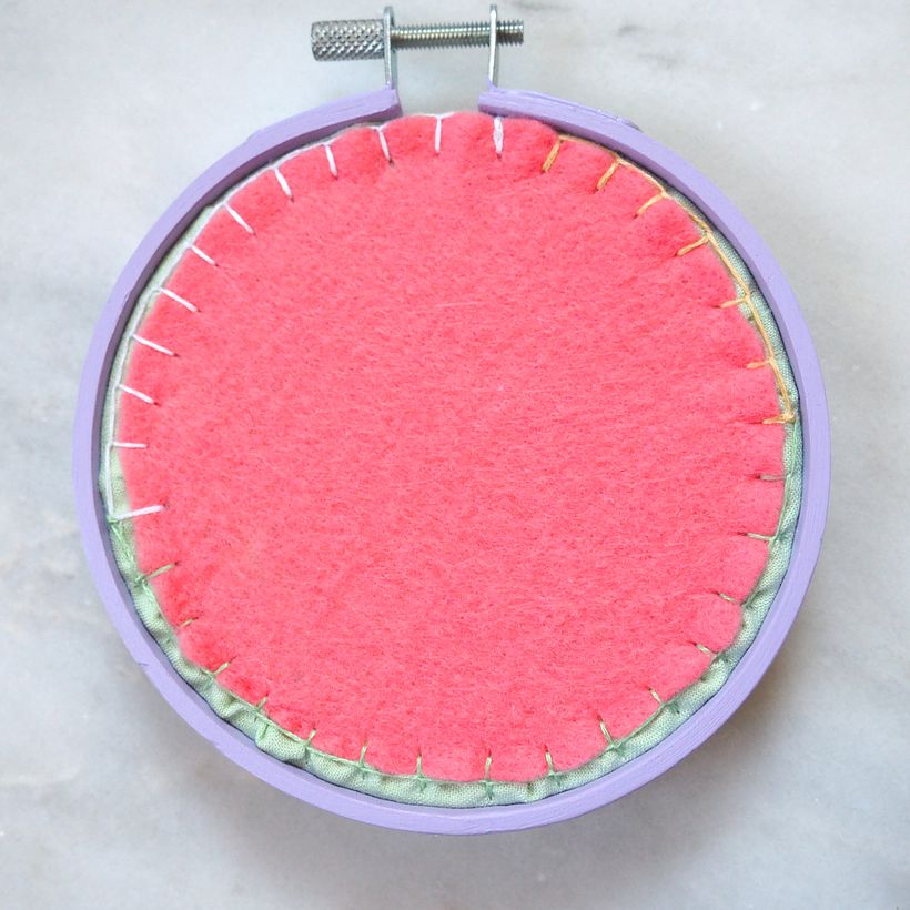 Wool felt, cotton embroidery thread, bamboo embroidery hoop painted with acrylic paint.
