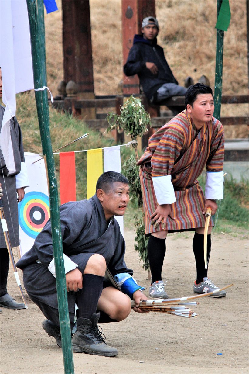 Archery, the national sport of Bhutan. Training grounds and cheerful gatherings can be observed all around the country.