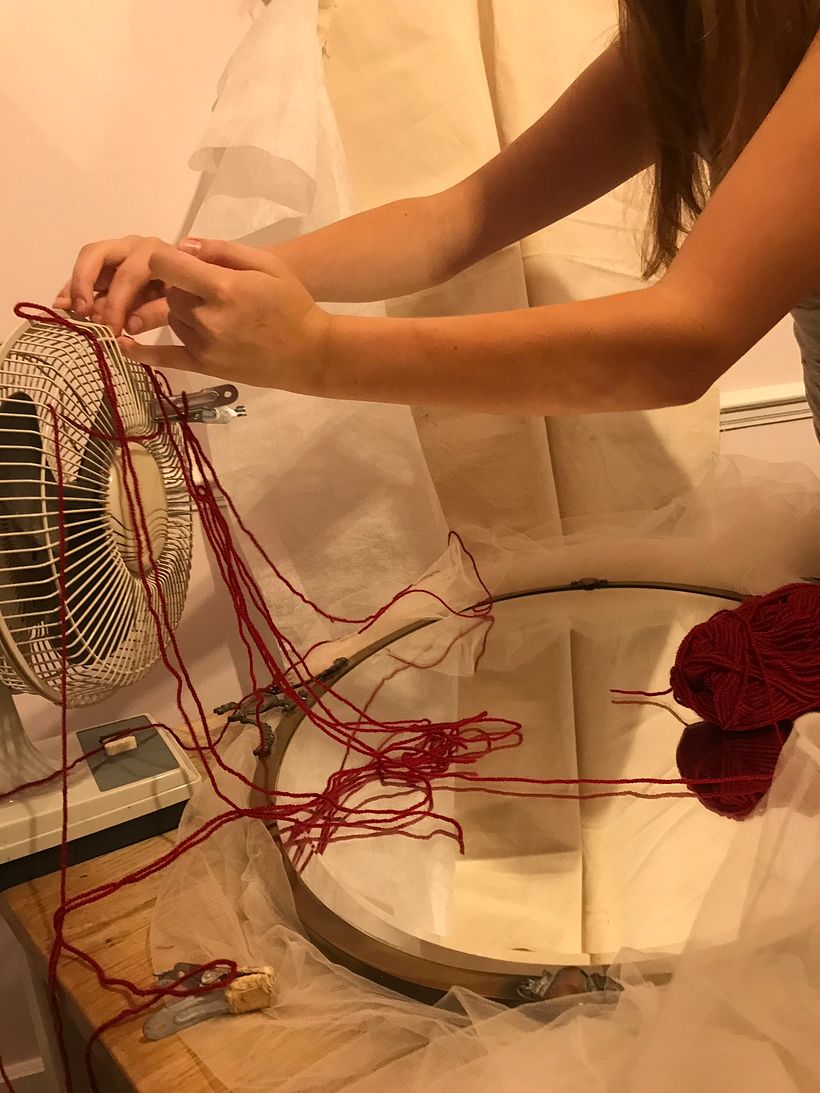 a small fan was used to help make the wool fly.