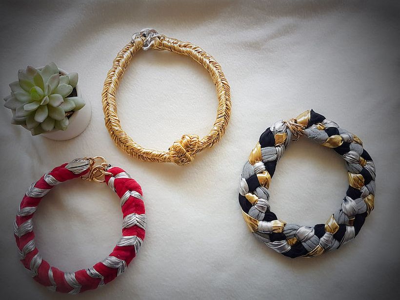 Jewelry by Elizabeth Vega.