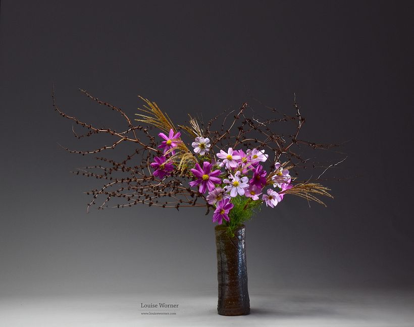 Foraged miscanthus and branches with cosmos.