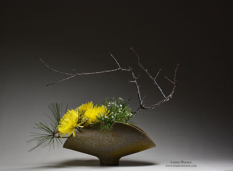 Foraged branches and pine with chrysanthemum