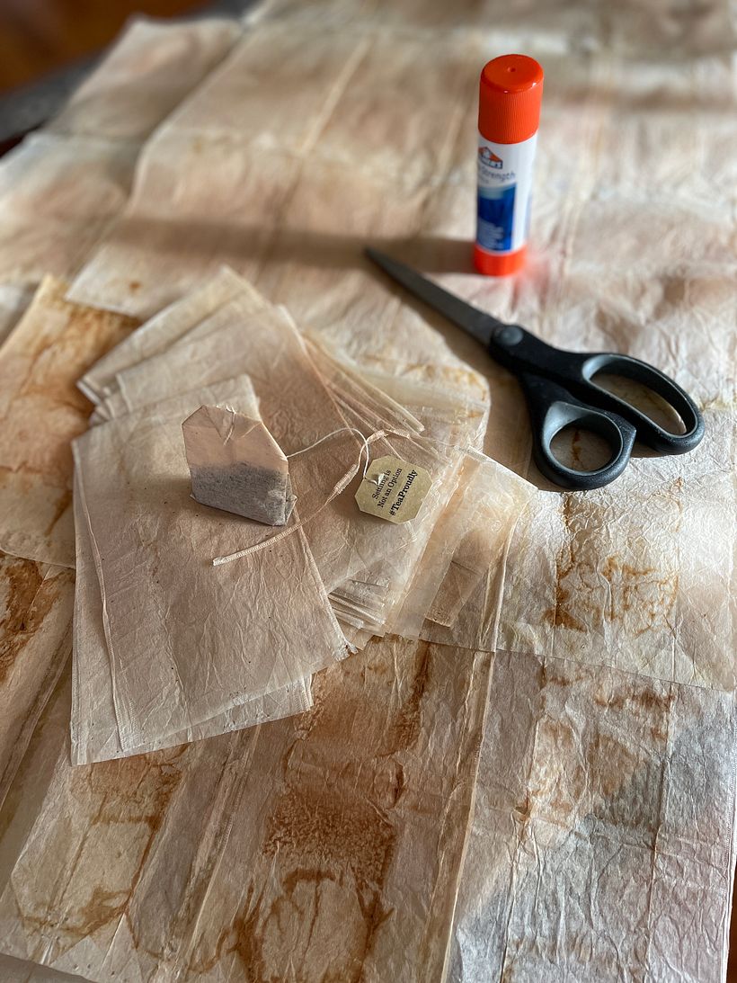 Emptied and ironed tea bags glued together to create the "fabric"
