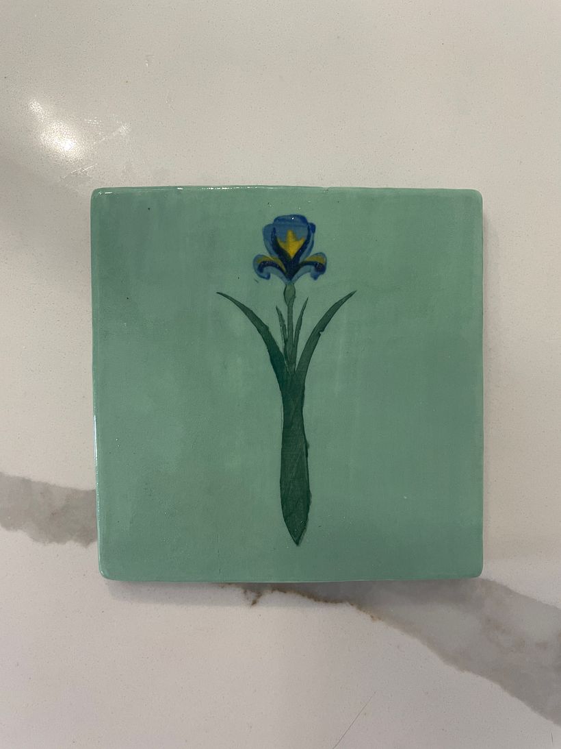 Underglaze applied with a stencil designed and cut myself. I like it!
