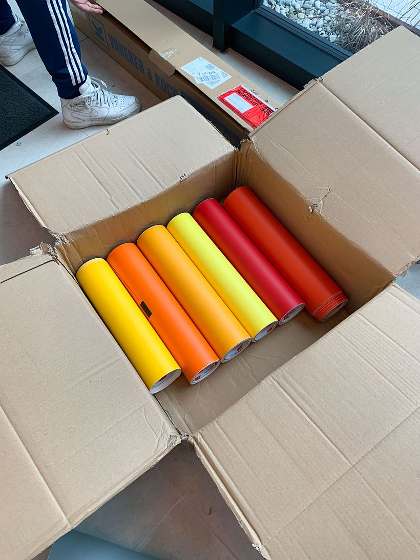 Unpacking adhesive foils for a Tape Art mural