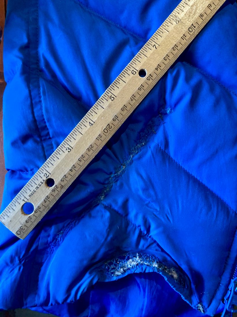 A burned long ski coat tail resulted in scars.  I’m trying to cover with embroidery.  Any thought or ideas?  The one at the 