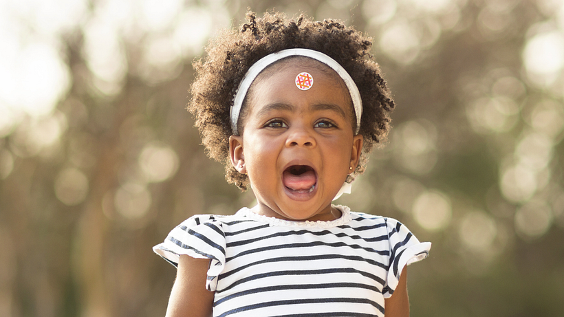A girl wearing her generated logo sticker for The Huntington (Talia Cotton)