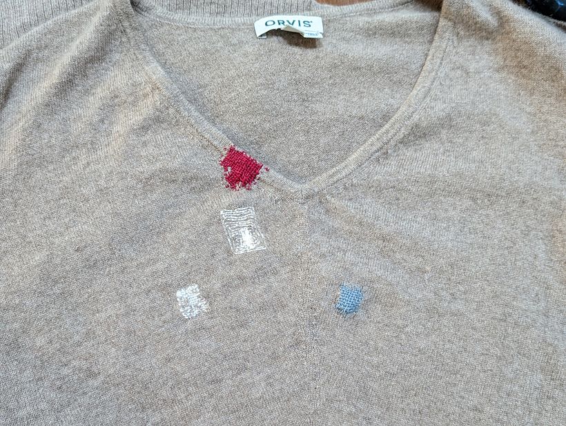 Old mends (white) and new (red and blue).