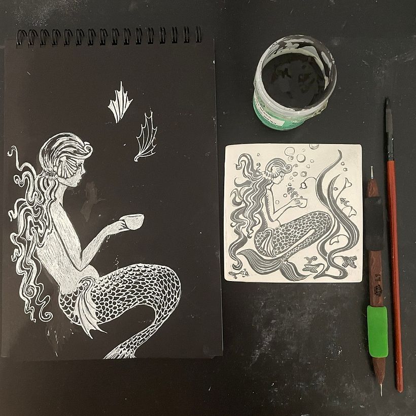 The initial sketch with the some tools and the un fired tile.