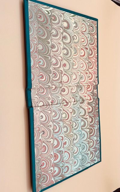 Handmade marble paper for the end paper.
