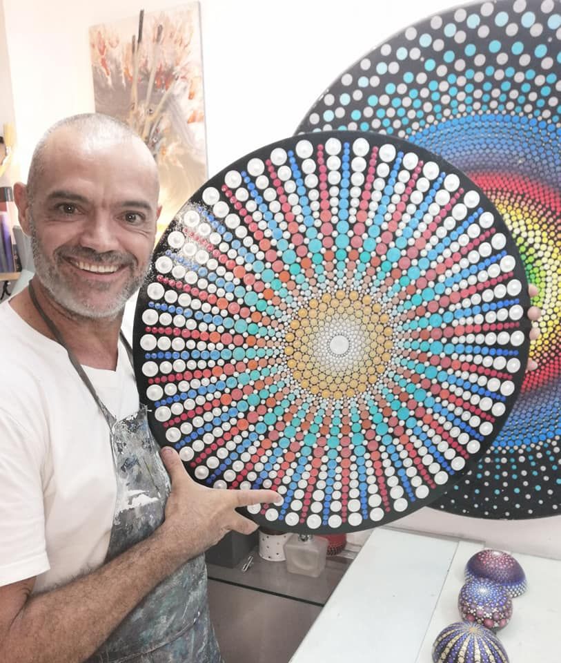 The first dot Mandala in metallic and iridescent acrylic paints on MDF board, sold by Art is Art Gallery.