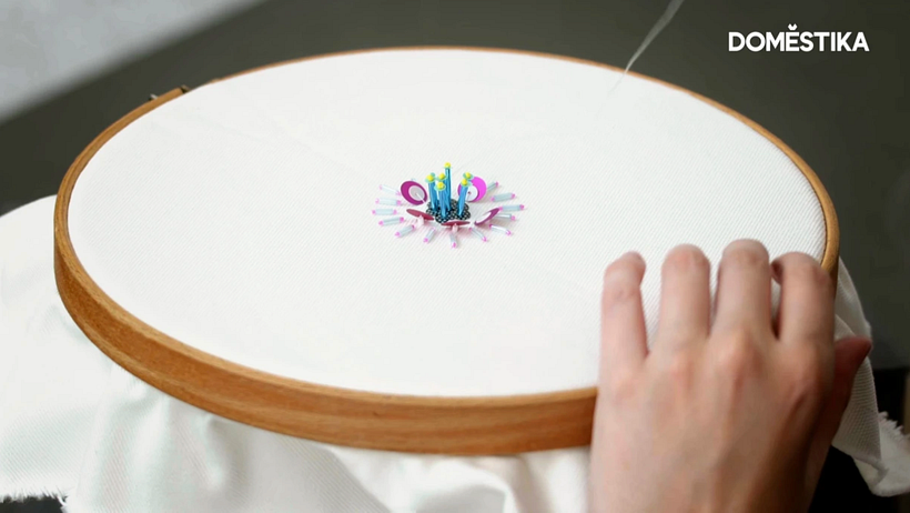Create an embroidered floral embellishment step by step.
