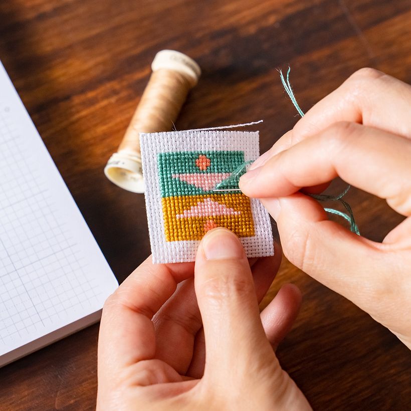 Cross stitching the tiny pillow!