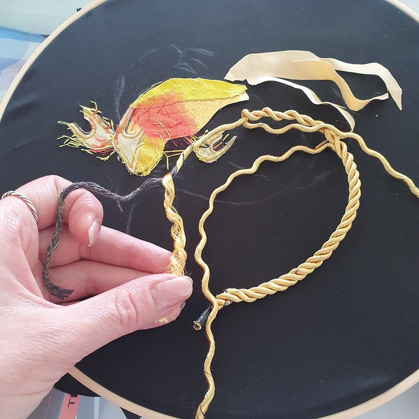 I reused decorative package handles to create the tail