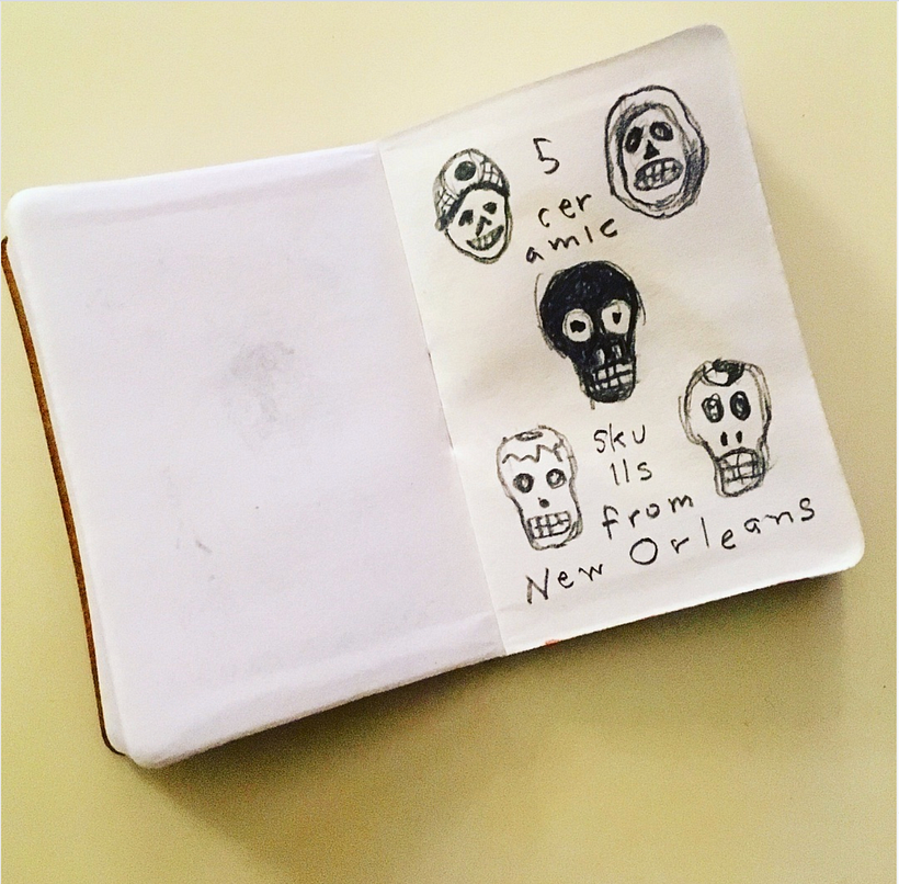 5 black + white ceramic skulls from New Orleans