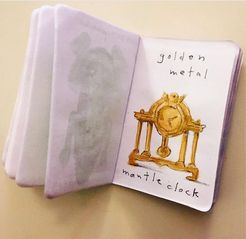 Golden metal mantle clock