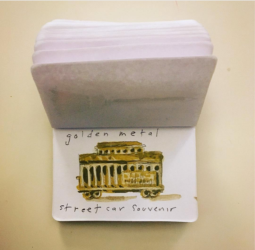 Golden-colored metal street car souvenir