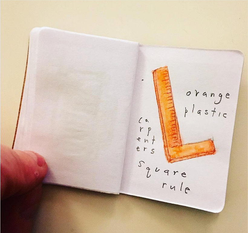 Orange plastic carpenter's square rule