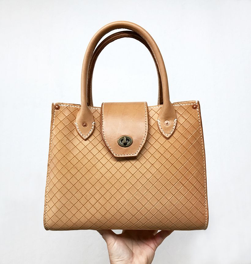The Studio Tote was incised by hand to create a lattice surface pattern.
