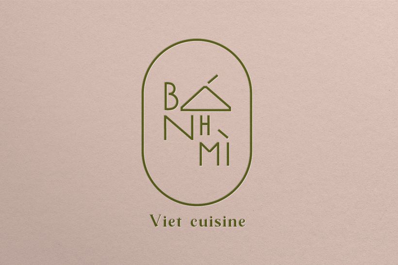 Logo represents a baguette as well as golden coin which is held by a lucky cat.