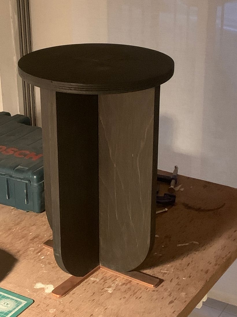 Stool in Beech Ply. Stained in black with a rubbed oil finish. Copper strip legs ( an afterthought for stability) 2