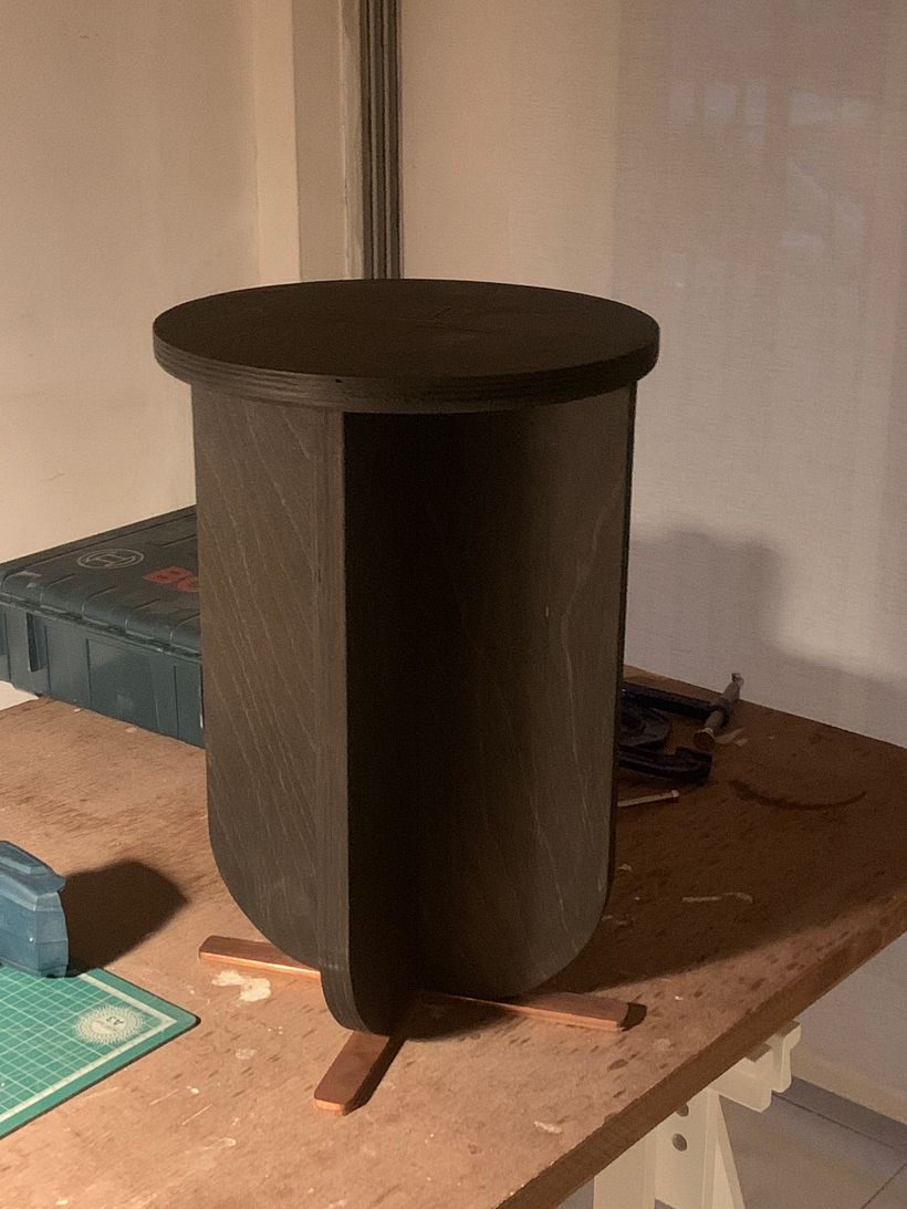 Stool in Beech Ply. Stained in black with a rubbed oil finish. Copper strip legs ( an afterthought for stability) 2