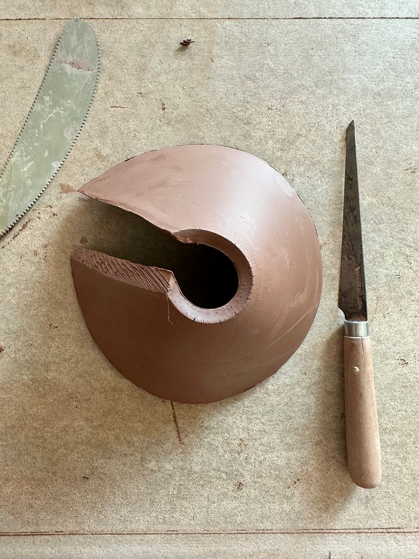 making the cone that will eventually be the shoulder of the vase