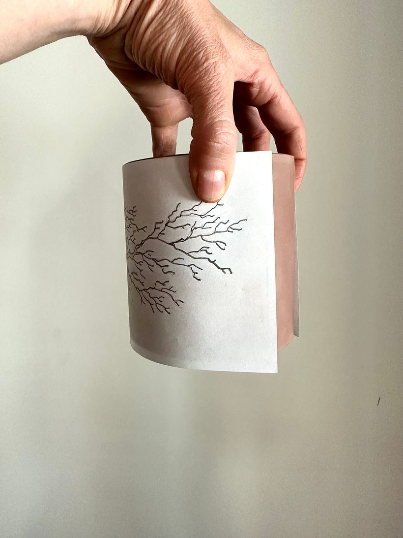 wrapping the design around the clay cylinder