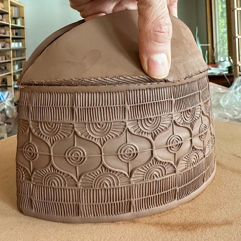 joining the two almond shapes to the top