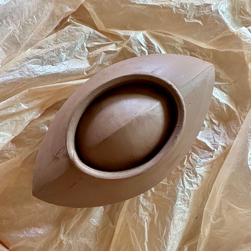 making sure lid fits inside the teapot collar