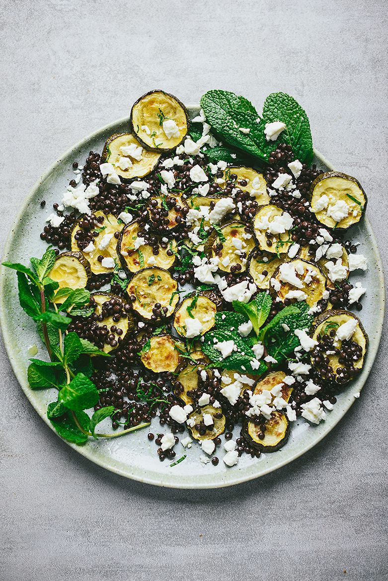 Salad of roasted zucchini and black lentils with feta cheese and mint