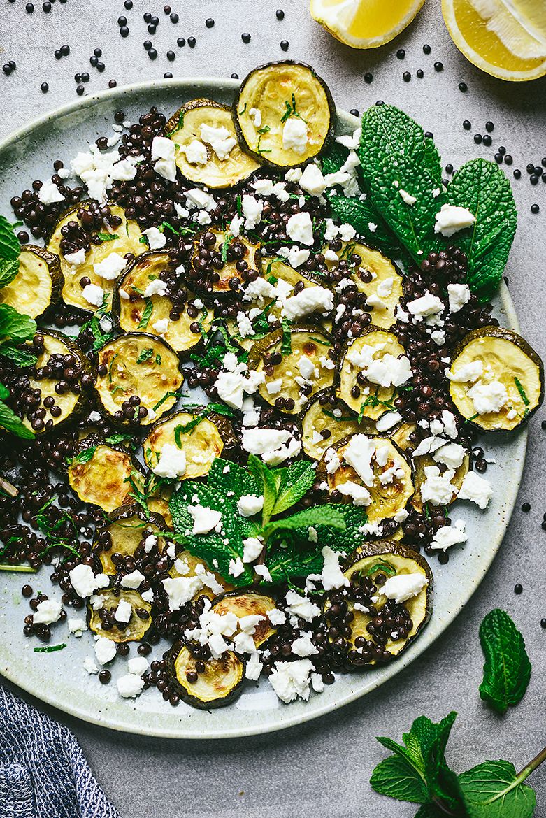 Salad of roasted zucchini and black lentils with feta cheese and mint