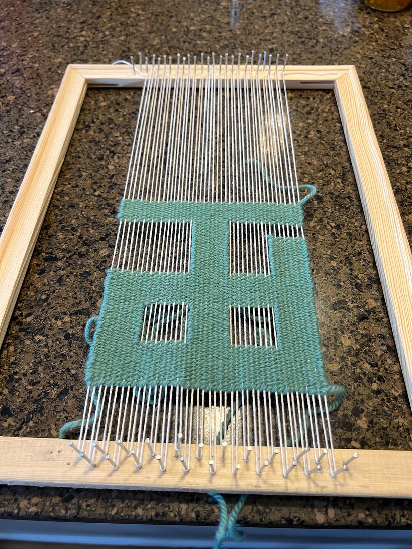 Starting the background weaving. 