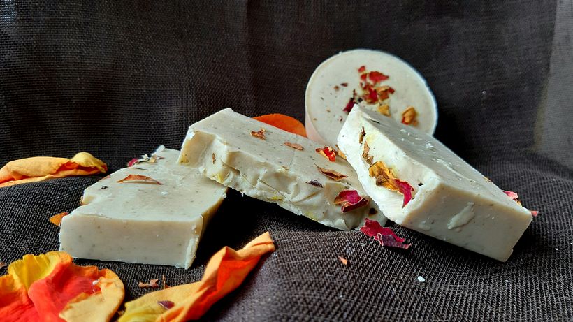 Pink soap, according to Marta's recipe, with rose petals on top.