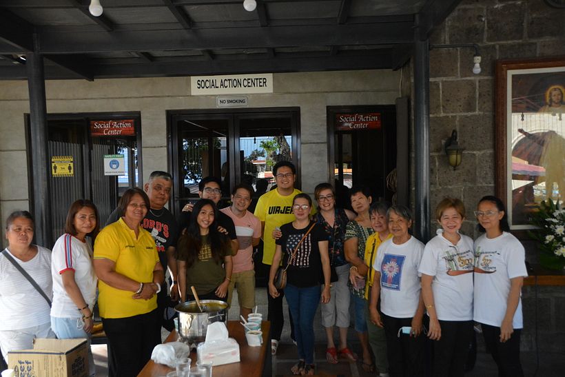 The Priest in charge of the feeding program together with the church volunteers and sponsors. 