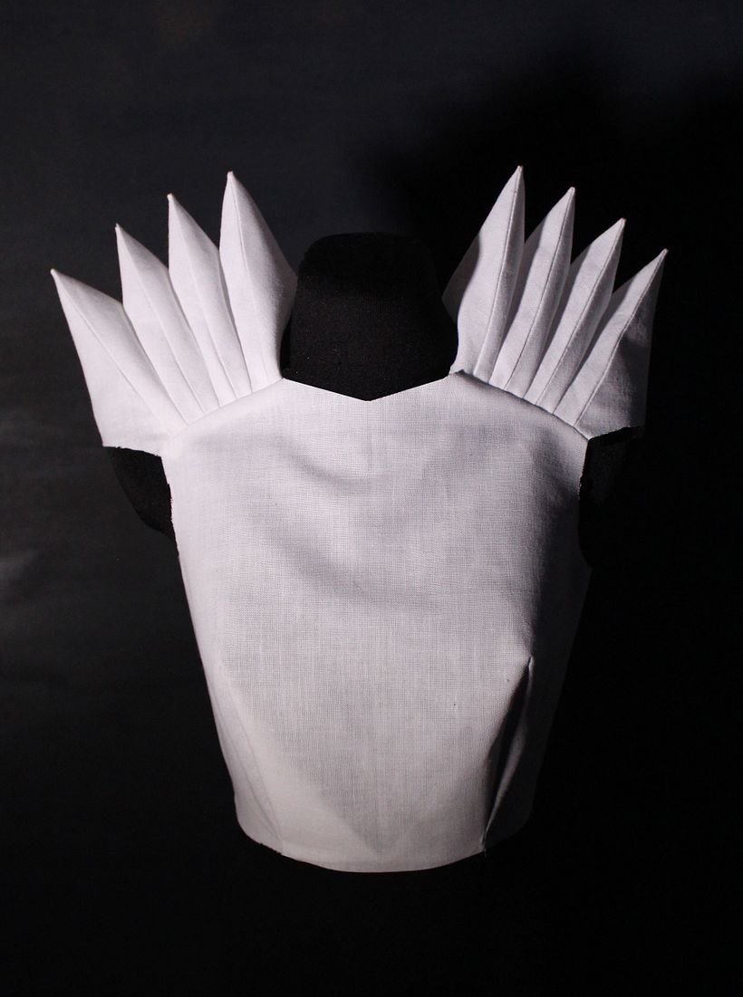 Accordion pleats at the shoulders. 