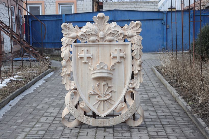 Wood carving. Coat of arms. Carved crest made of linden (basswood) wood - Woodworking