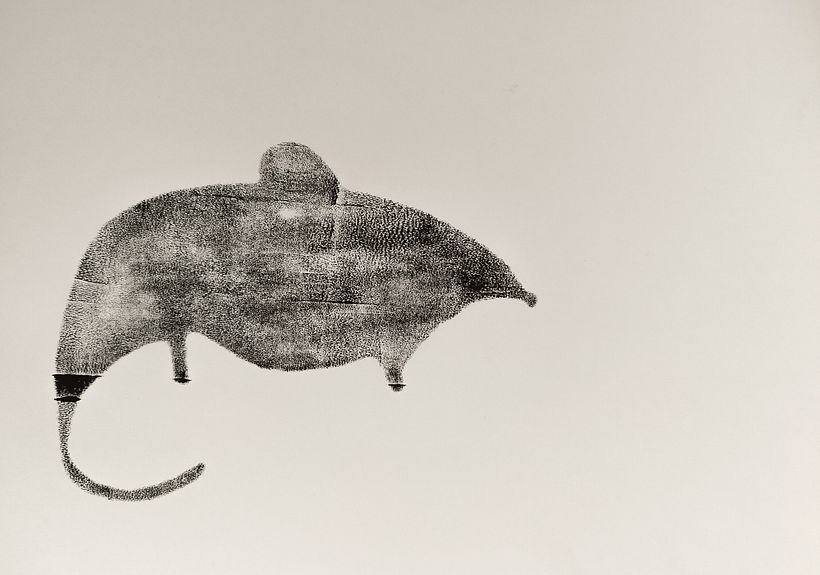 The mouse is attached with a velcro to the book and several other pages.