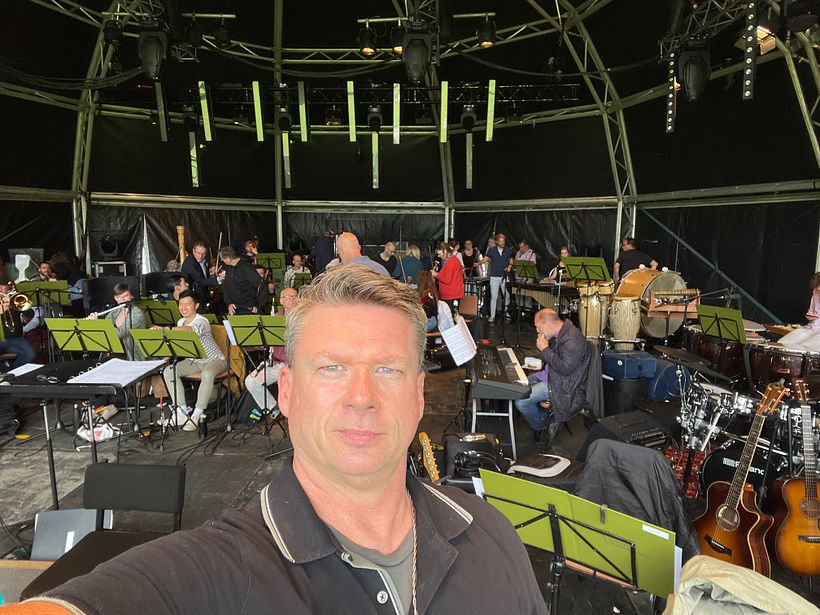 Getting ready to rehearse the concert - the orchestra arrives!