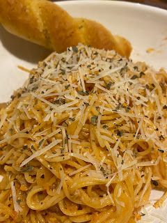 Raunzel: Angel Hair pasta with ground turkey and vodka tomato sauce and braided bread sticks