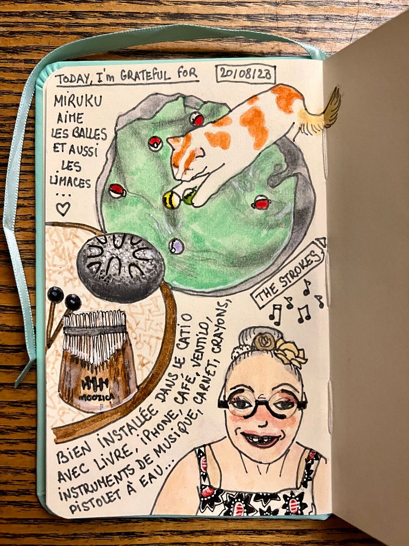 I settled in the catio with book, iPhone, coffee, electric fan, musical instruments, sketchbook, pencils, watergun...!